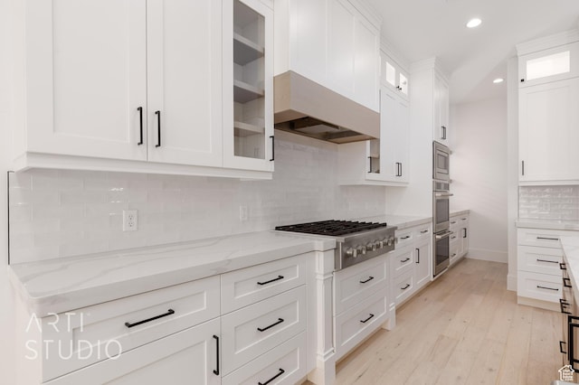 3855 S Kennedy Ln, Washington, UT 84780 - kitchen with stainless steel appliances, white cabinetry, recessed lighting, light wood finished floors, and light stone counters