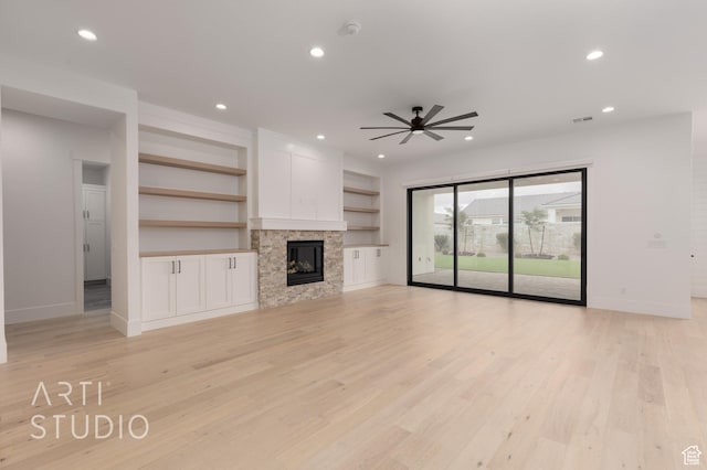 3855 S Kennedy Ln, Washington, UT 84780 - unfurnished living room featuring baseboards, ceiling fan, light wood-type flooring, recessed lighting, and a tiled fireplace