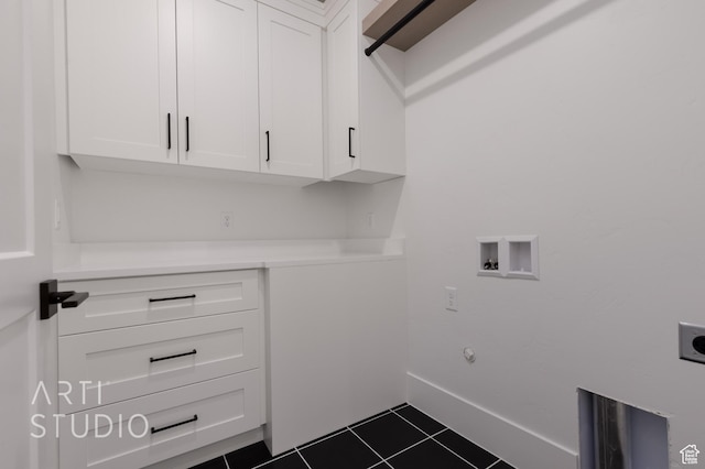 3855 S Kennedy Ln, Washington, UT 84780 - clothes washing area with hookup for an electric dryer, cabinet space, washer hookup, dark tile patterned flooring, and baseboards