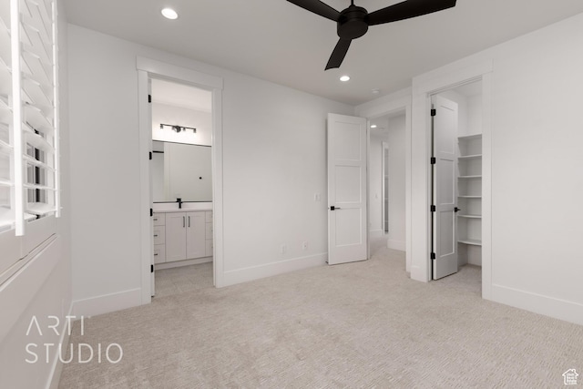 3855 S Kennedy Ln, Washington, UT 84780 - unfurnished bedroom with light carpet, recessed lighting, baseboards, a spacious closet, and connected bathroom