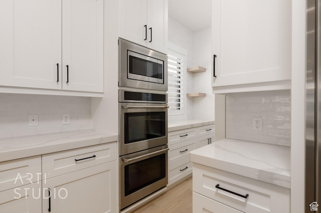 3855 S Kennedy Ln, Washington, UT 84780 - kitchen featuring stainless steel appliances, tasteful backsplash, white cabinets, open shelves, and light stone counters