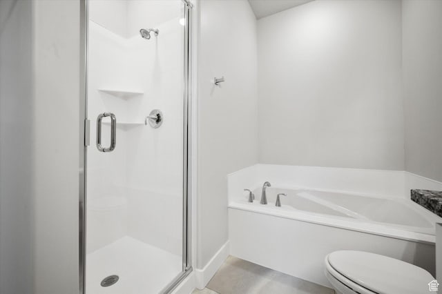 bathroom with a shower stall, toilet, and a bath