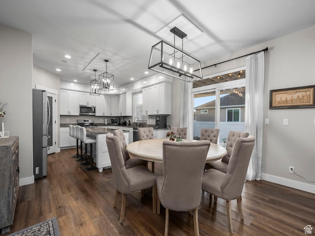 dining space with a chandelier, baseboards, dark wood-style floors, and recessed lighting