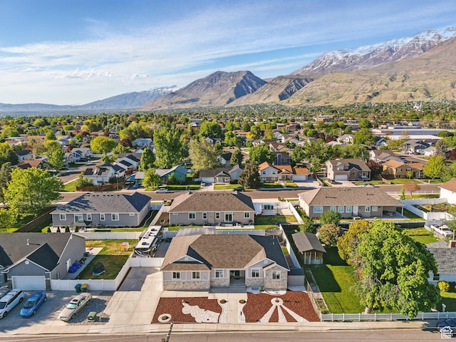 aerial view of residential area featuring a mountain backdrop