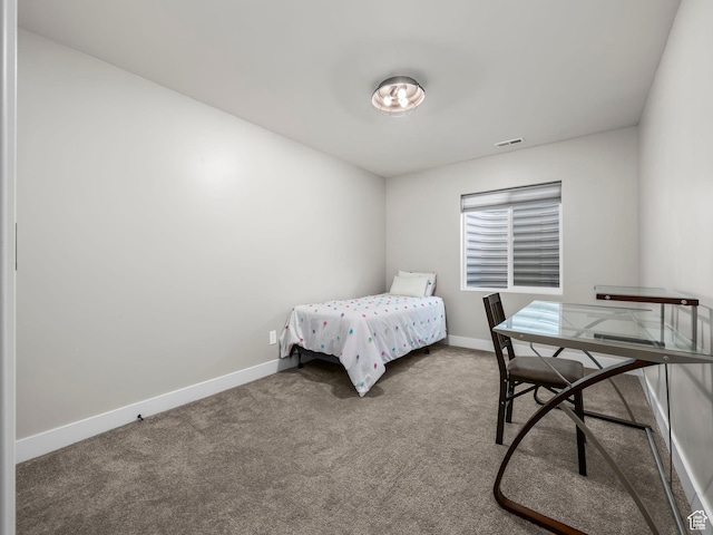 carpeted bedroom featuring baseboards
