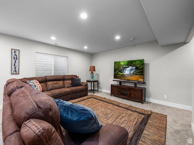 carpeted living area featuring baseboards and recessed lighting