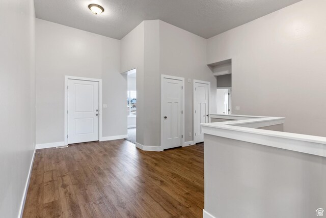 2363 E 370 N Unit 07, Spanish Fork, UT 84660 - corridor with a towering ceiling, baseboards, and wood finished floors