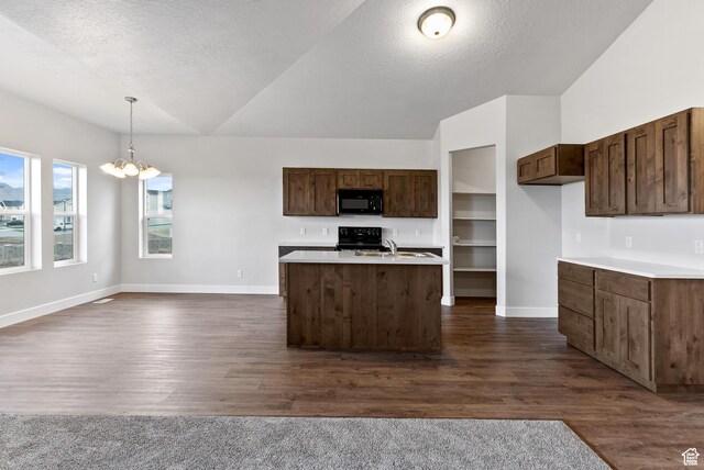 2363 E 370 N Unit 07, Spanish Fork, UT 84660 - kitchen with black appliances, vaulted ceiling, light countertops, baseboards, and a chandelier
