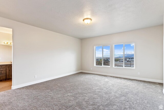 2363 E 370 N Unit 07, Spanish Fork, UT 84660 - carpeted empty room featuring baseboards and a textured ceiling