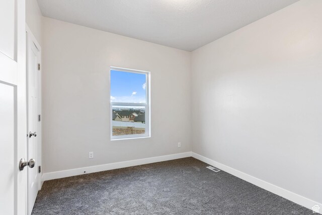 2363 E 370 N Unit 07, Spanish Fork, UT 84660 - empty room with dark colored carpet and baseboards