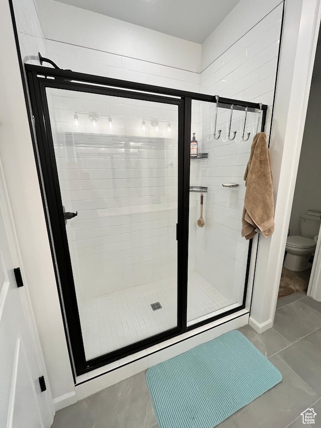 2055 S 4140 W, Taylor, UT 84401 - full bath with a shower stall, toilet, and tile patterned floors