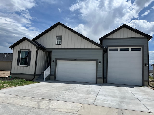 2055 S 4140 W, Taylor, UT 84401 - view of front facade featuring a garage and driveway