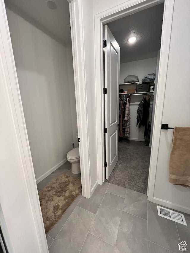 2055 S 4140 W, Taylor, UT 84401 - bathroom with a walk in closet, toilet, and baseboards