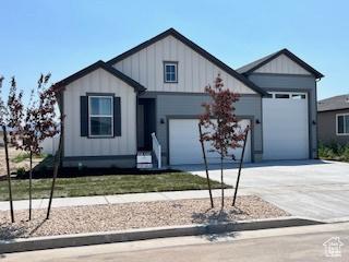 2055 S 4140 W, Taylor, UT 84401 - view of front facade featuring concrete driveway and a garage