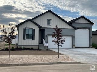 2055 S 4140 W, Taylor, UT 84401 - view of front of home with an attached garage and driveway