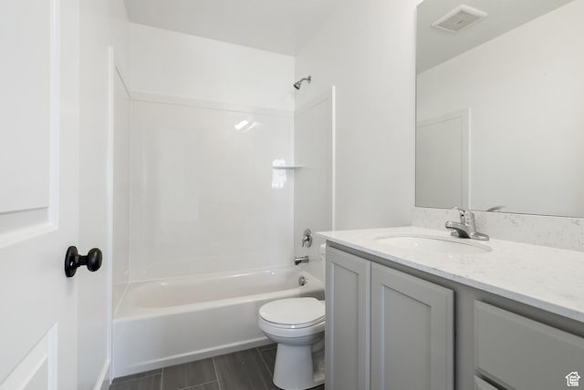 bathroom featuring vanity, shower / bath combination, toilet, and wood finished floors