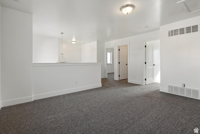 empty room with carpet and baseboards