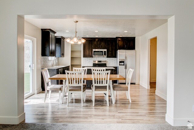 362 N 2350 E Unit 10, Spanish Fork, UT 84660 - dining area featuring healthy amount of natural light, a chandelier, baseboards, and recessed lighting