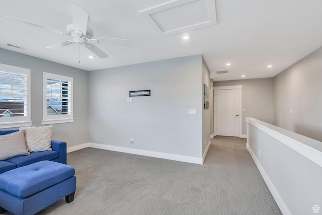 sitting room with baseboards, carpet flooring, attic access, recessed lighting, and ceiling fan