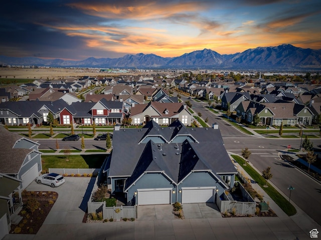 aerial view of residential area featuring a mountain backdrop