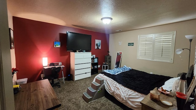 carpeted bedroom with a textured ceiling