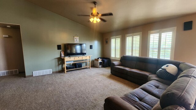 living room with carpet floors, healthy amount of natural light, ceiling fan, lofted ceiling, and baseboards