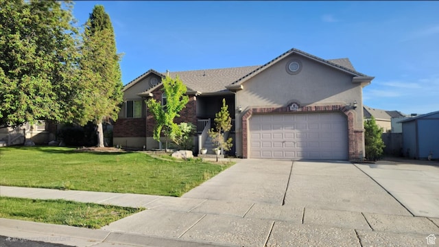 view of front of home with a garage, a front lawn, concrete driveway, and brick siding