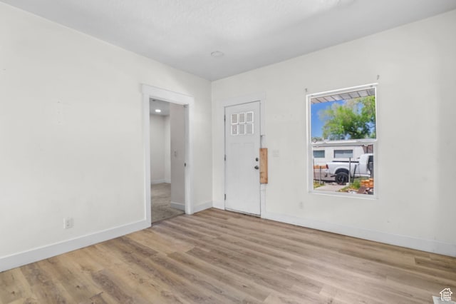 8885 W Magna Main St, Magna, UT 84044 - unfurnished room featuring wood finished floors and baseboards