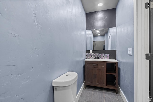 8885 W Magna Main St, Magna, UT 84044 - bathroom with toilet, baseboards, tile patterned floors, and vanity