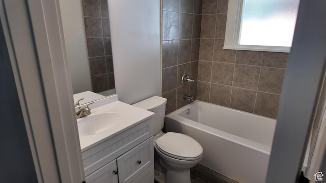 bathroom with toilet, vanity, and shower / tub combination