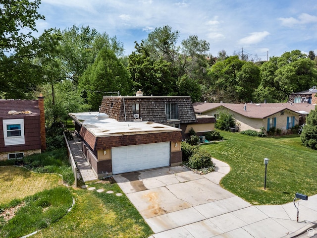 853 N 1250 W, Provo, UT 84604 - view of front facade featuring a front lawn, concrete driveway, and a chimney