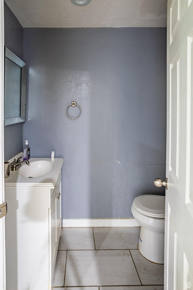 853 N 1250 W, Provo, UT 84604 - bathroom with toilet, vanity, baseboards, and tile patterned floors
