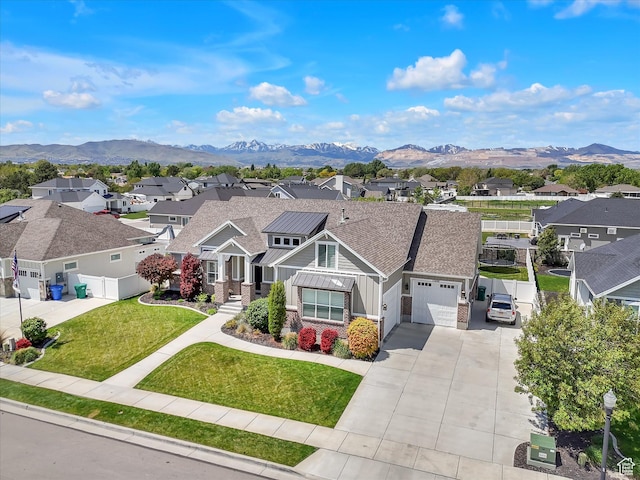 11896 S Verde View Cv, Riverton, UT 84065 - view of front of home featuring a residential view, an attached garage, a mountain view, and board and batten siding