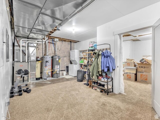 11896 S Verde View Cv, Riverton, UT 84065 - exercise area with secured water heater, carpet flooring, and washer / dryer