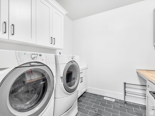 11896 S Verde View Cv, Riverton, UT 84065 - laundry room featuring washer and clothes dryer, cabinet space, and dark tile patterned floors