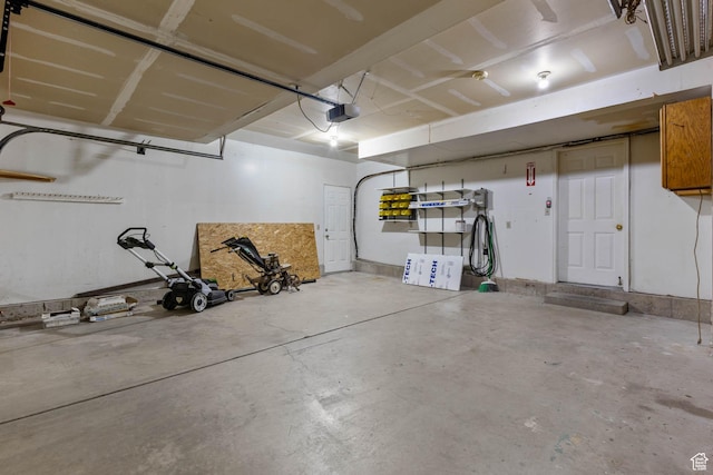 133 N Lakeview W Unit 39, Stansbury Park, UT 84074 - garage featuring a garage door opener