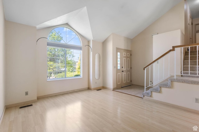 133 N Lakeview W Unit 39, Stansbury Park, UT 84074 - foyer entrance with vaulted ceiling, wood finished floors, plenty of natural light, and stairs