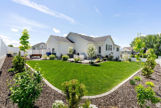 rear view of property with stucco siding and a patio