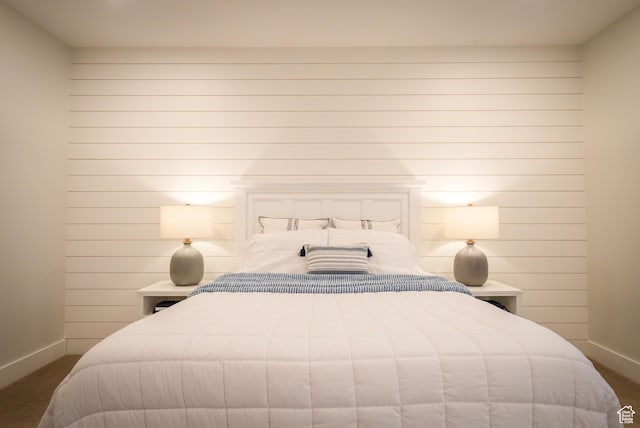 bedroom with baseboards and carpet flooring