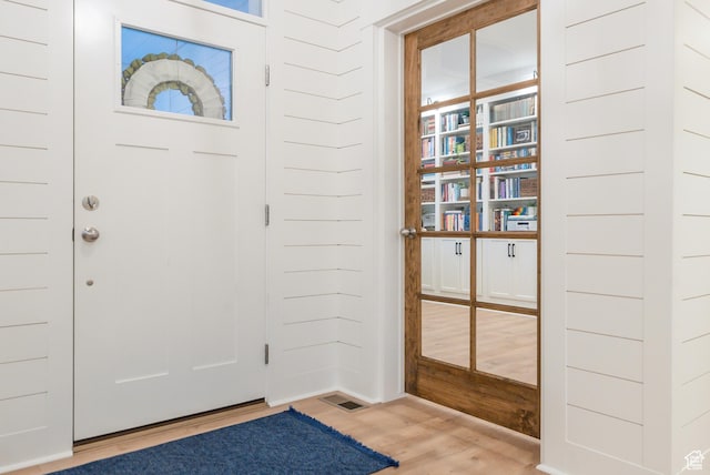 foyer entrance featuring wood finished floors