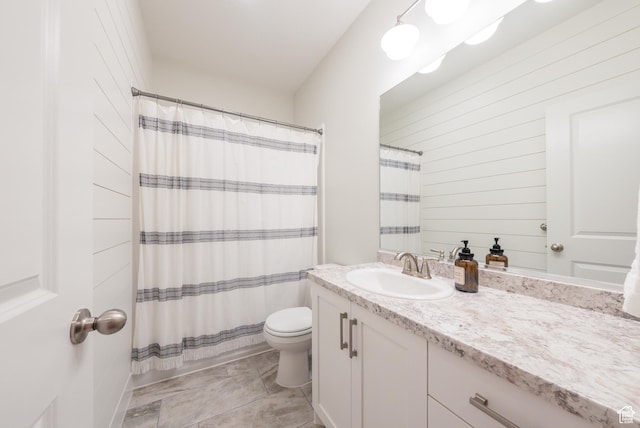 full bath with vanity, toilet, curtained shower, and tile patterned flooring