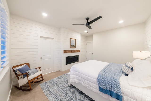 bedroom featuring carpet flooring, recessed lighting, a fireplace, and a ceiling fan