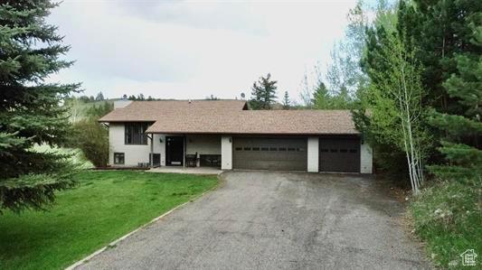 1204 Nashua Cir, Soda Springs, ID 83276 - single story home featuring a front lawn, a garage, and driveway