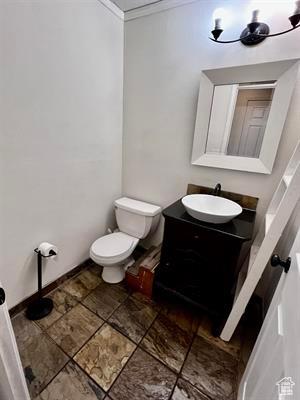 1204 Nashua Cir, Soda Springs, ID 83276 - half bathroom featuring crown molding, vanity, and toilet