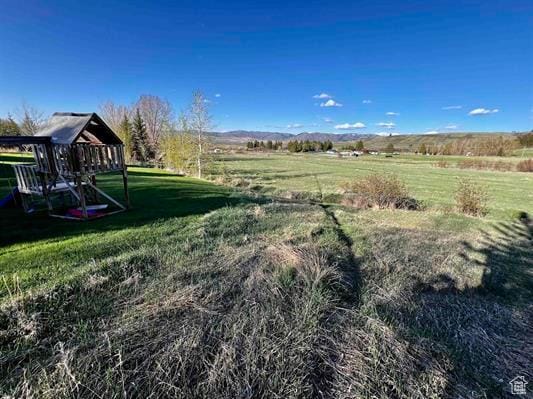 1204 Nashua Cir, Soda Springs, ID 83276 - view of grassy yard featuring a playground