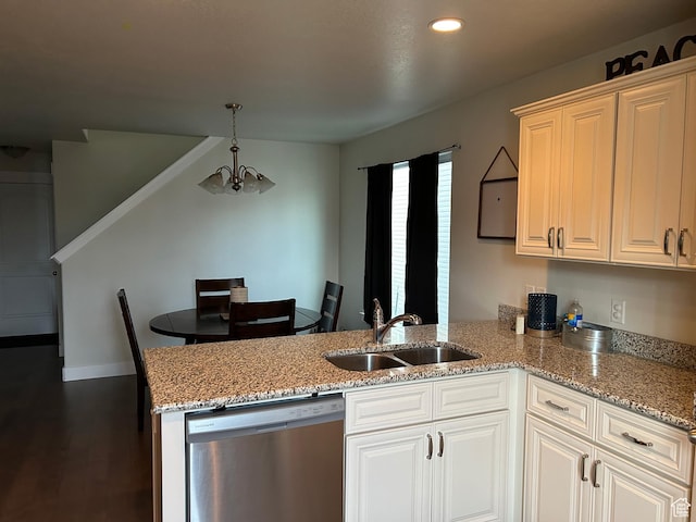 kitchen with dishwasher, a sink, a peninsula, a chandelier, and light stone counters