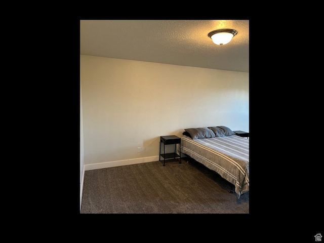 bedroom with carpet and baseboards