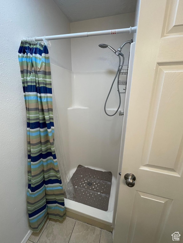 8027 W Copperfield Pl S # 12, Magna, UT 84044 - full bath with curtained shower and tile patterned floors