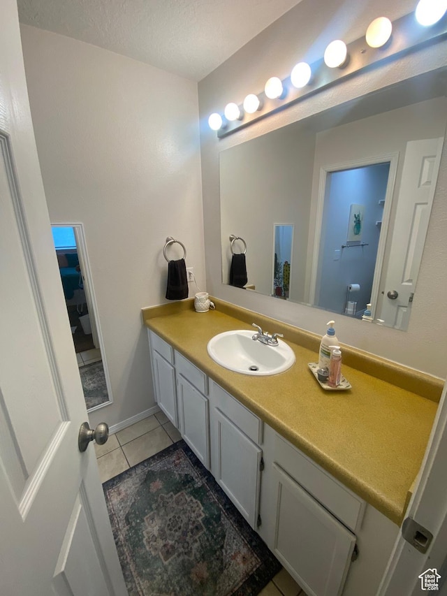 8027 W Copperfield Pl S # 12, Magna, UT 84044 - bathroom with vanity and tile patterned floors