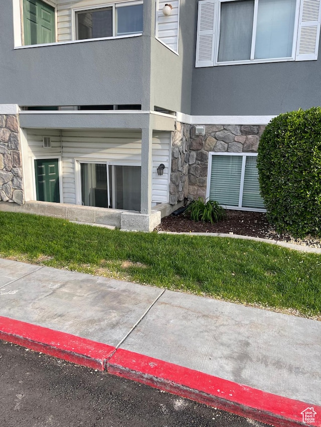 8027 W Copperfield Pl S # 12, Magna, UT 84044 - doorway to property with stone siding and a balcony